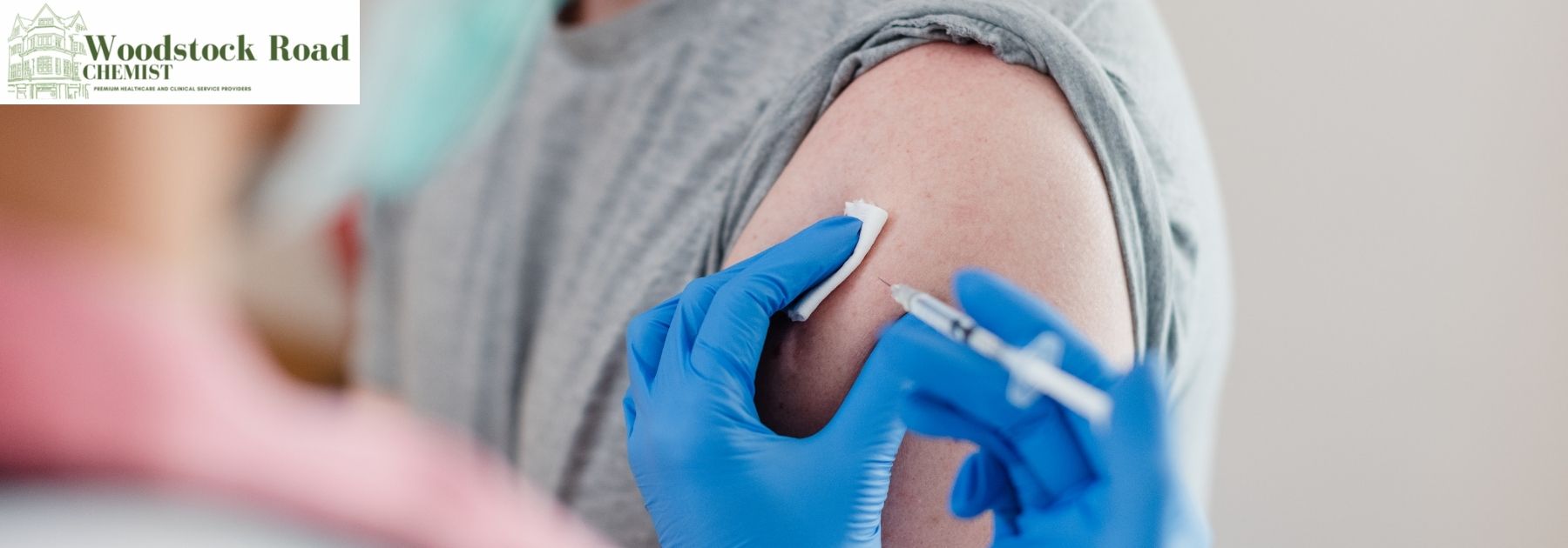 pharmacist giving patient rabies vaccine