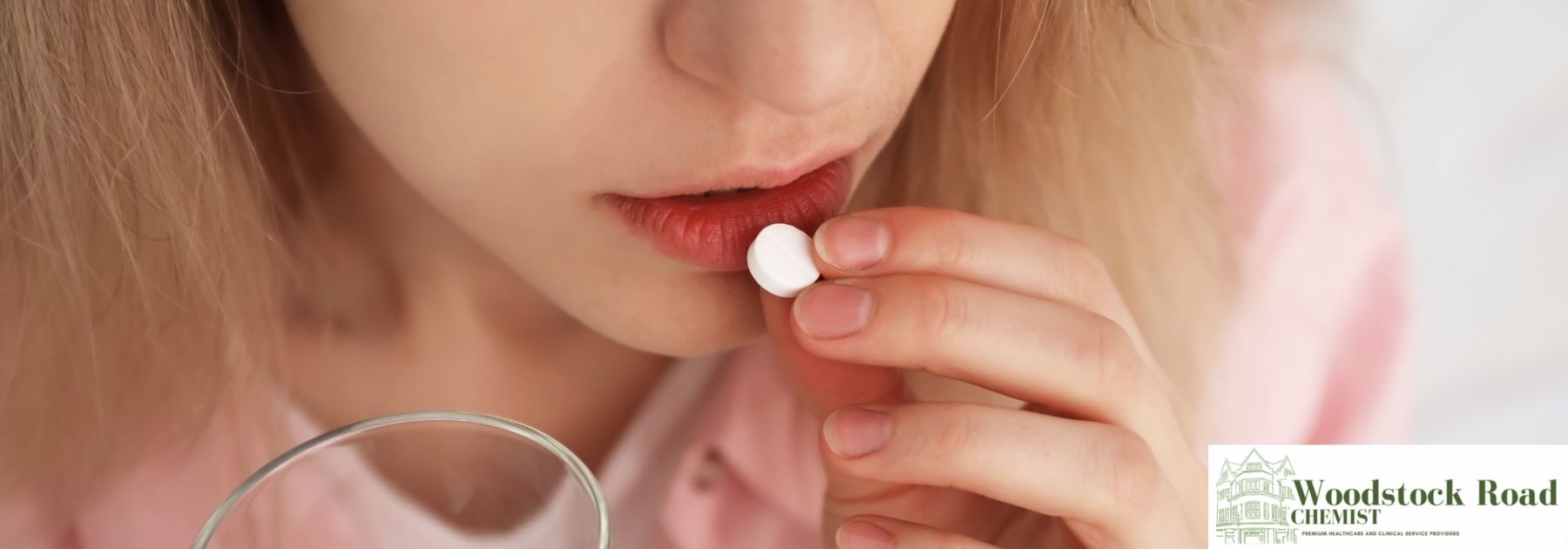 person taking malaria pill